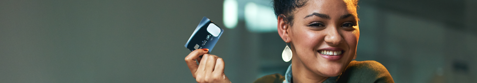 woman holding credit card